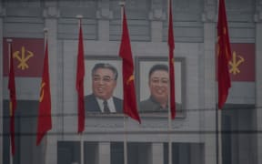 Portraits of late North Korean leaders Kim Il-Sung and Kim Jong-Il on the 'April 25 Palace', the venue of the 7th Workers Party Congress in Pyongyang.