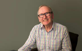 John Daysh with a picture of his grandfather Norman