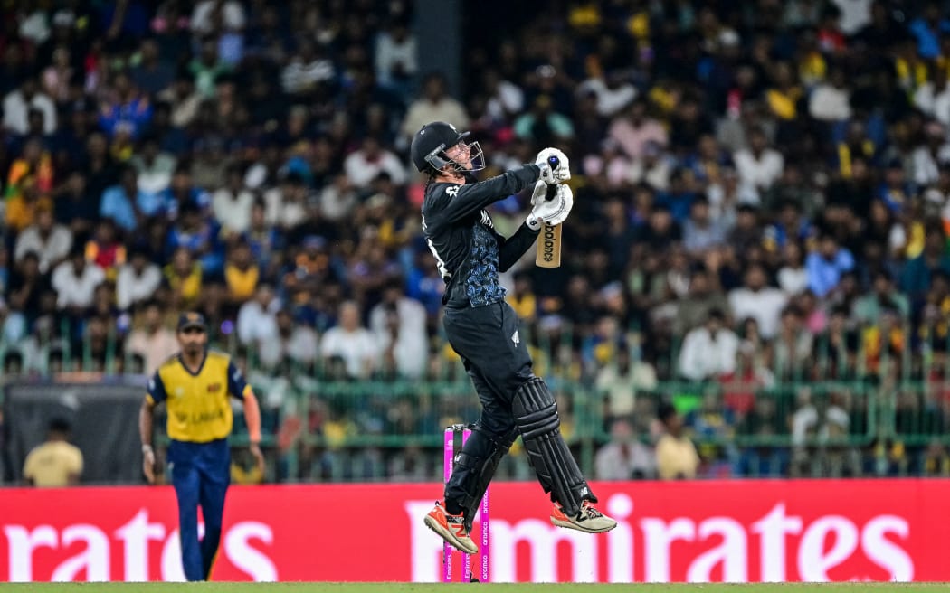New Zealand's captain Mitchell Santner plays a shot during the 2026 ICC Men's T20 Cricket World Cup Super Eights match between Sri Lanka and New Zealand at the R Premadasa Stadium in Colombo on February 25, 2026. (Photo by Ishara S. KODIKARA / AFP)