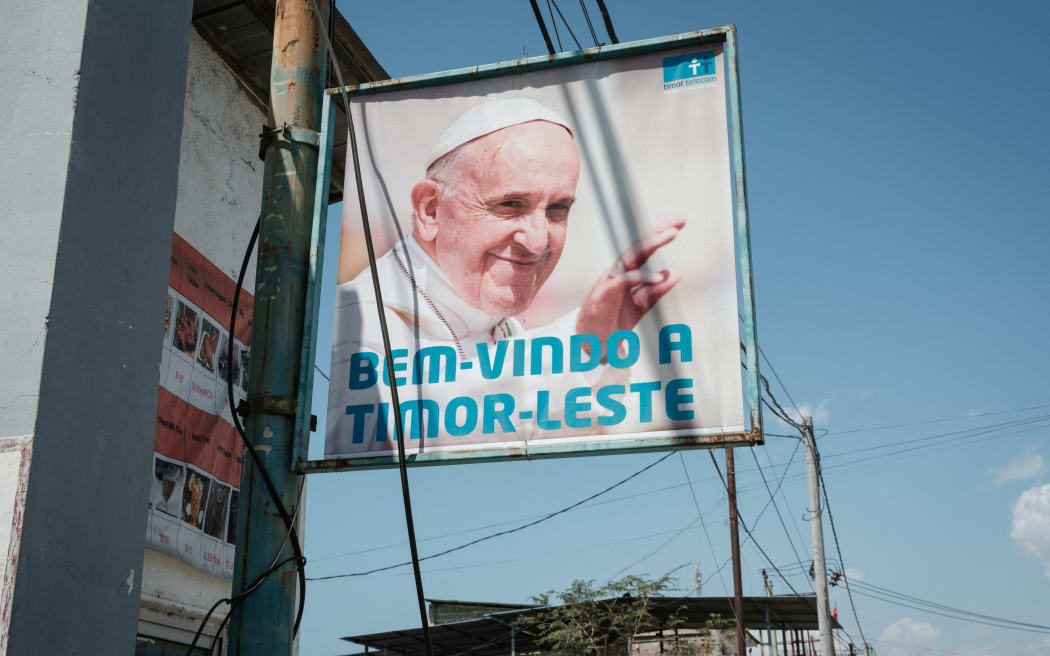 A welcoming message is installed along the road ahead of Pope Francis' visit in Dili on September 7, 2024. (Photo by Yasuyoshi CHIBA / AFP)