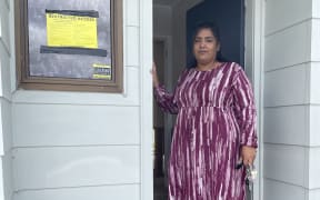 Izma Azad at her yellow-stickered West Auckland home.