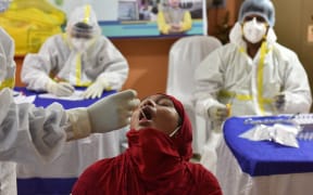 A girl gets tested for Covid-19 in Kolkata.