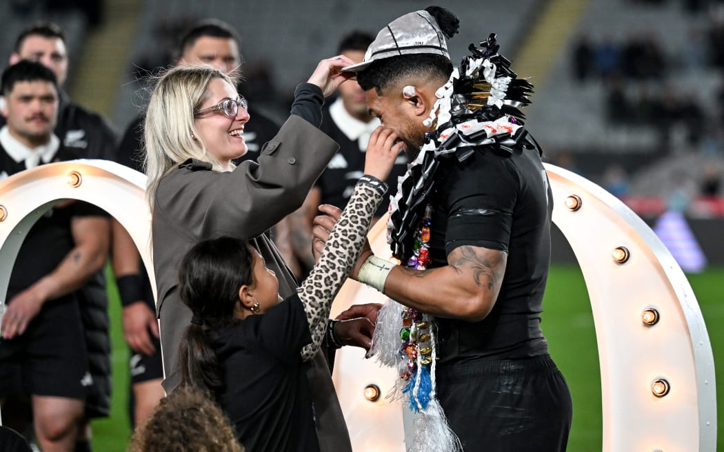 Ardie Savea is presented his 100th All Blacks Test Match cap by wife Saskia.