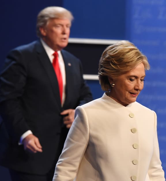 Donald Trump and Hillary Clinton exit the stage after their third and final presidential debate.