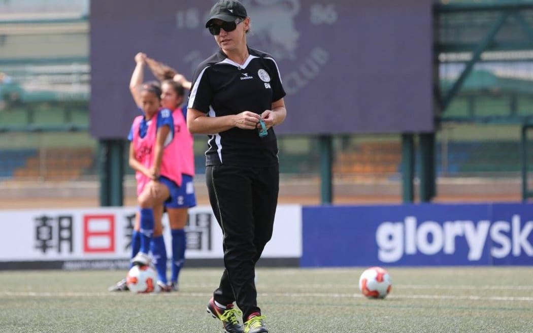 Guam women's coach Belinda Wilson leads training in Hong Kong.