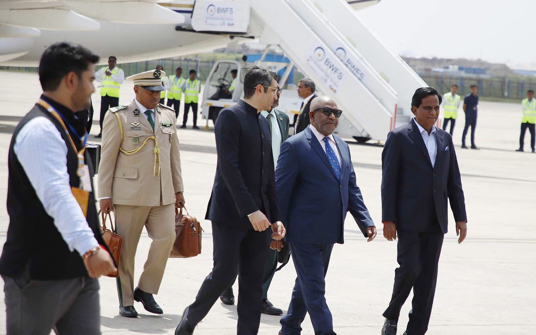 Union of Comoros's President and Chairperson of the African Union, Azali Assoumani (2R) arrives at the airport on the eve of two-day G20 summit in New Delhi on September 8, 2023.