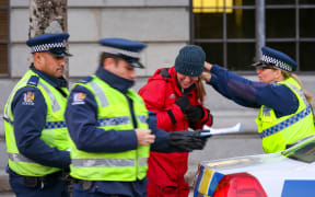 Greenpeace protester being arrested.