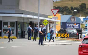 Police swarmed Taradale CBD following gang-related altercations on Sunday.
Caption:
Police swarmed Taradale CBD following gang-related altercations on Sunday.