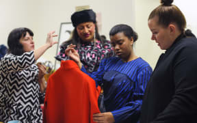 Director Kate Spencer Producer Jaye Galm and Mentor Meredith Walshe give designer Havilah Arsende advice.