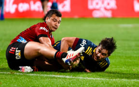 Connor Garden-Bachop scores the matching-winning try for the Highlanders in the tackle of David Havili.