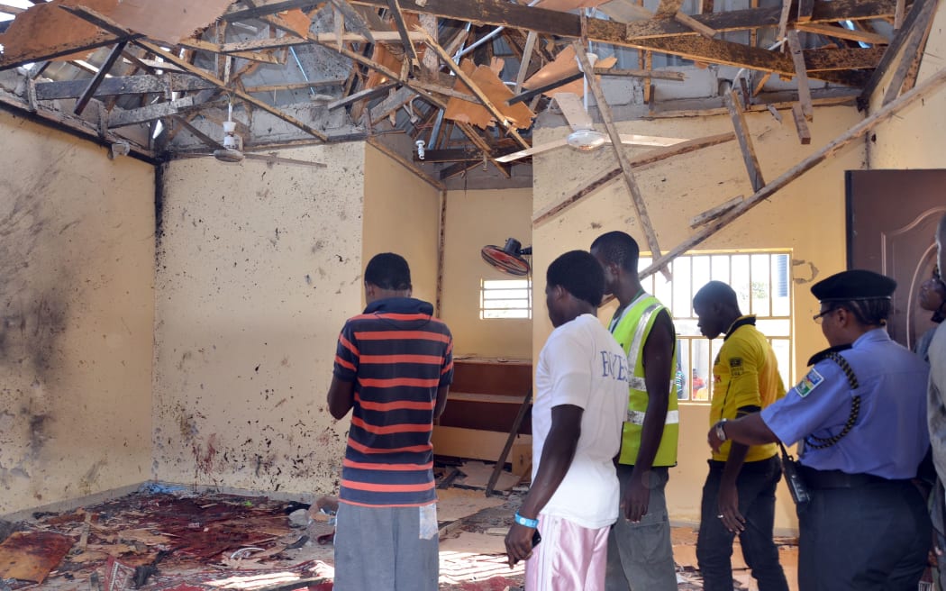 The aftermath of a bombing during Friday prayers at a mosque in Maiduguri.