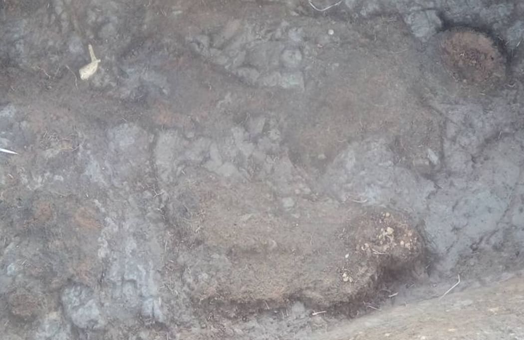 Inside a grave.