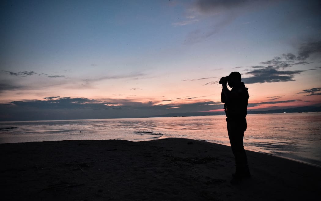 A police officer patrols the delta of Evros river, near Alexandroupoli, along the Greek-Turkish border, on 8 June 2021.