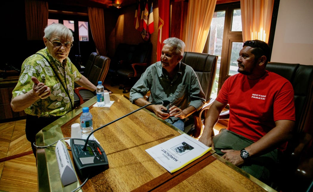 Bruno Barillot, (left), talks to Roland Oldham, president of Moruroa e Tatou and Father Auguste Uebe-Carlson, president of 193 anti-nuclear association.
