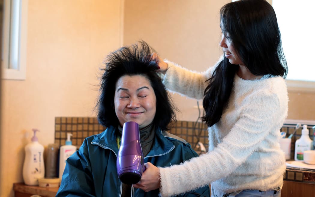 Alicia Wong and her mother Kai, who suffered a stroke.