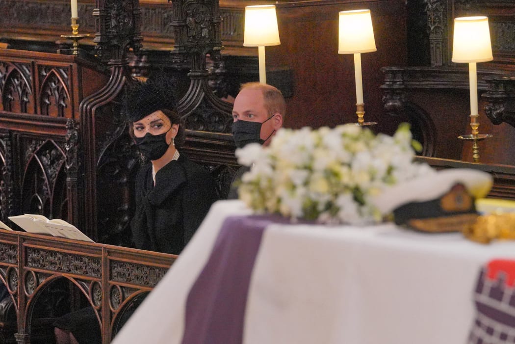 Britain's Catherine, Duchess of Cambridge and Britain's Prince William, Duke of Cambridge attend the funeral service of Britain's Prince Philip, Duke of Edinburgh inside St George's Chapel in Windsor Castle in Windsor, west of London, on April 17, 2021.
