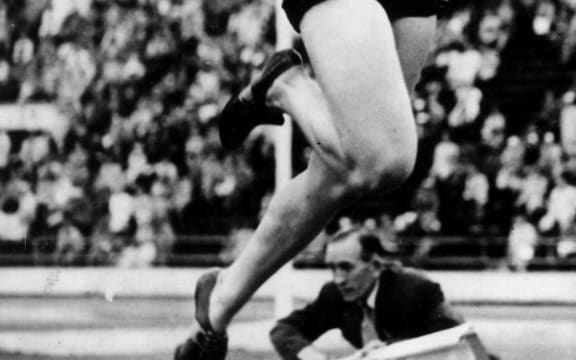 Yvette Williams jumps her way to an Olympic Gold medal with a jump of 6.24m. Helsinki Olympic Games, 1952.