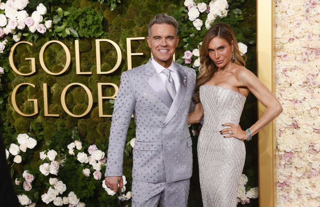 (From L) British singer Robbie Williams and his wife Ayda Field arrive for the 82nd annual Golden Globe Awards at the Beverly Hilton hotel in Beverly Hills, California, on January 5, 2025.