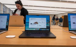 NEW YORK, NEW YORK - JUNE 25: Apple products, including computers, are displayed in one of its stores in lower Manhattan on June 25, 2026 in New York City. Blaming rising costs of memory and storage chips, Apple raised the prices of the iPad and MacBook on Thursday. The company announced that iPhone prices will not be affected.   Spencer Platt/Getty Images/AFP (Photo by SPENCER PLATT / GETTY IMAGES NORTH AMERICA / Getty Images via AFP)