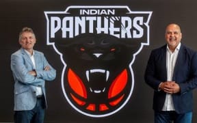 Sky's Justin Nelson, left, and InBL Pro chief executive Parveen Batish show the Indian Panthers logo.