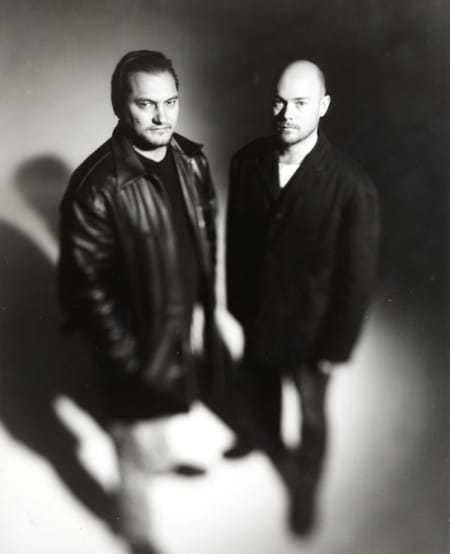 Mark Tierney and Paul Casserly are two men in jackets shot from above in black and white.