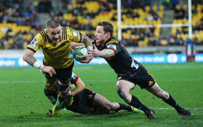 Hurricanes TJ Perenara scores a try.