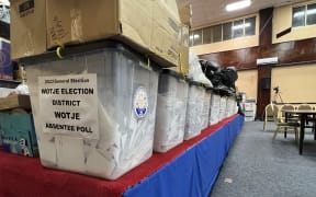 After the closing of polling stations during the 20 November election, the ballot boxes were brought into the tabulation headquarters and lined up to await counting. Photo: Giff Johnson.