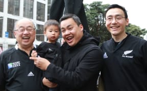 All Blacks fans the Chiu family after the game against France.