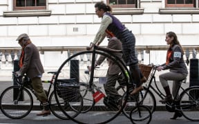 LONDON, UK - May 4, 2019. London Tweed Run. People with old bicycles and clothes