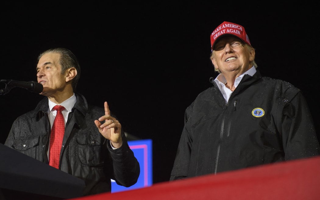 GREENSBURG, PA - MAY 06: Pennsylvania Republican U.S. Senate candidate Dr. Mehmet Oz joins former President Donald Trump onstage during a rally in support of his campaign at the Westmoreland County Fairgrounds on May 6, 2022 Former President Trump endorsed Dr. Oz in the Pennsylvania Republican primary race for the U.S. Senate over his top opponent David McCormick.   Jeff Swensen/Getty Images/AFP (Photo by JEFF SWENSEN / GETTY IMAGES NORTH AMERICA / Getty Images via AFP)