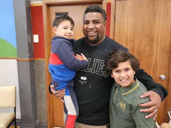 Semi Ratuniyauravu with his sons Ifereimi Ratuniyauravu (right) and Samisoni Ratuniyauravu in his arms.