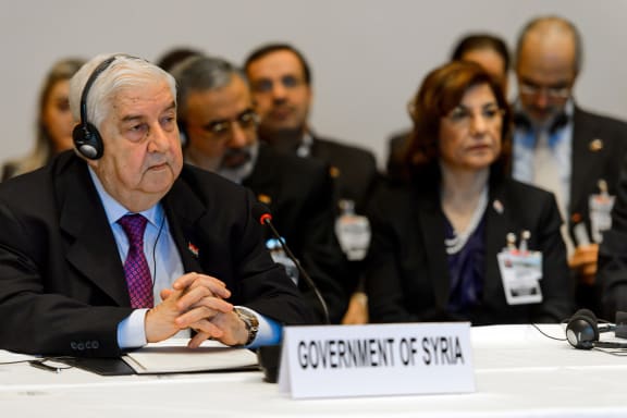 Syrian Foreign Minister Walid Muallem (left) and his delegation.