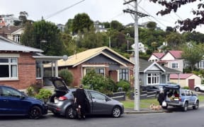 The three houses in Motu St in St Clair subject to dangerous building notices issued last night after it was found they could be at risk from a potential slip behind their properties.