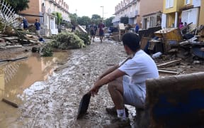This picture taken on November 1, 2024 shows the devastating effects of flooding on a residential area in the town of Massanassa, in the region of Valencia, eastern Spain. - Spanish defense minister announced today the arrival of an additional 500 soldiers in southeastern Spain, reinforcing the 1,200 already present, to assist in relief operations for the victims of this week’s deadly floods. Dozens of people remain missing three days after the start of devastating floods that have killed 158 people. (Photo by JOSE JORDAN / AFP)