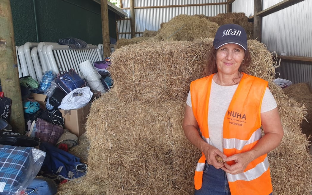 Debbie Lang is looking after some of the donated stock feed dropped off at the Hastings Racecourse in the wake of Cyclone Gabrielle