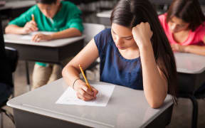 High school students working in a classroom.
