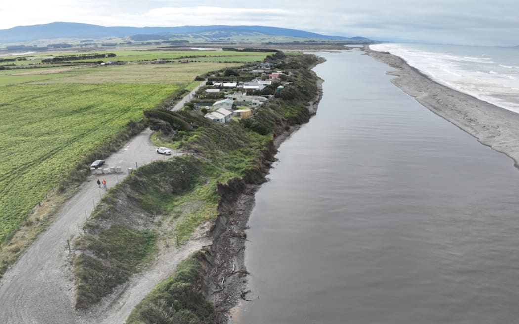 An aerial view of the coastal Southland settlement of Bluecliffs, which is set for evacuation on 8 March, 2024, ahead of work to clear the dump site.