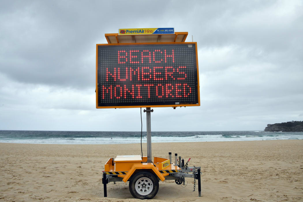 A public health order notice is seen at an almost empty Bondi Beach on Christmas Day in Sydney