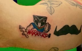 Warriors fan Karl Tily received a mystery Warriors-related tattoo ahead of the team playing in the NRL.