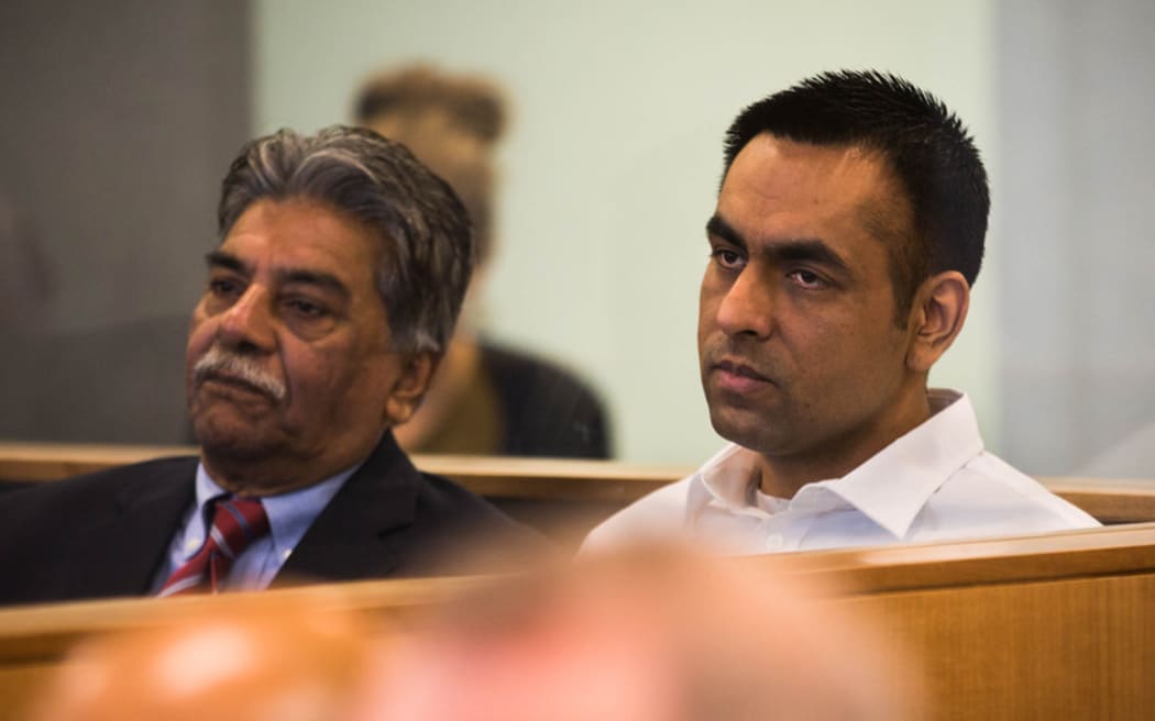 Gurjinder Singh (right) sitting in the dock at Auckland High Court with a translator (left).