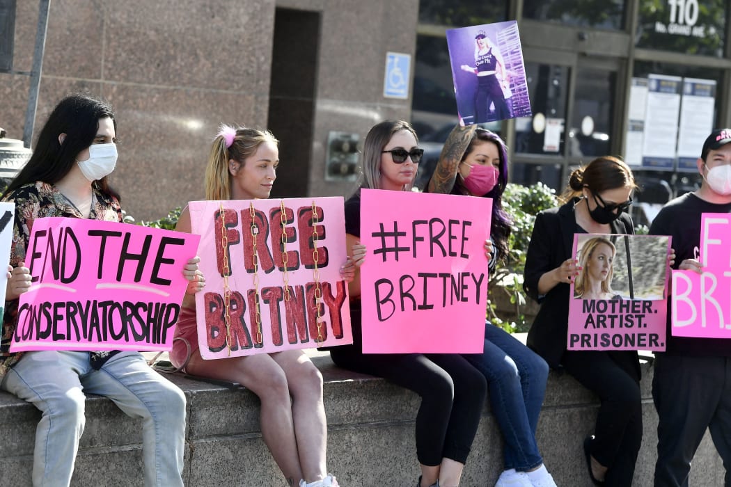 Supporters hold signs at a court hearing for the Britney Spears Conservatorship, in Los Angeles, this month.