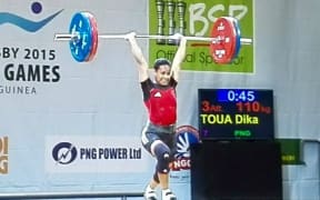 Papua New Guinea's Dika Toua wins weightlifting gold at the Pacific Games.