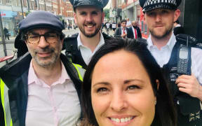 Rotorua woman Emma Rigby with police in Enfield, London, where she runs an online platform called Love Your Doorstep and a community patrol scheme.