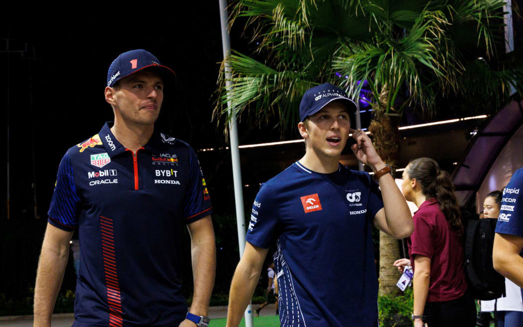 Max Verstappen (L) and Liam Lawson.