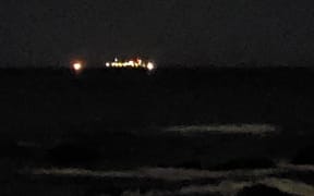 The lights of the stricken Connemara can be seen off Wellington's south coast.