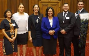 Left to right: Coralie Takuira Dargaville, Hine Kawana, Tahlia Kingi, Hekia Parata, Te Rerekohu Tūterangiwhiu and James Enright (wearing a korowai)
