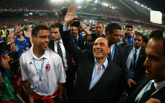 AC Milan's president Silvio Berlusconi (R) and Brazilian football star Ronaldo (L) arrive for the Champions League final football match against Liverpool at the Olympic Stadium, in Athens, 2007.