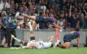 Xavier Coates scores the match winning try during the Melbourne Storm vs New Zealand Warriors match at AAMI Park, Melbourne.