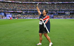 Silver medallist New Zealand's Maddison-Lee Wesche celebrates after the women's shot put final of the athletics event at the Paris 2024 Olympic Games at Stade de France in Saint-Denis, north of Paris, on August 9, 2024. (Photo by Andrej ISAKOVIC / AFP)