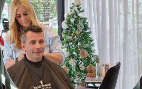 David Seymour gets a trim after announcing a review of hairdressing regulations. "Best hair in the coalition," he says.